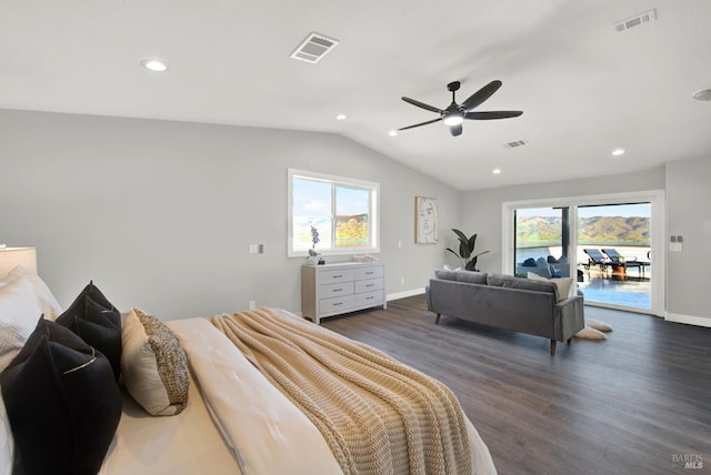 bedroom with multiple windows, vaulted ceiling, dark wood-type flooring, and access to exterior