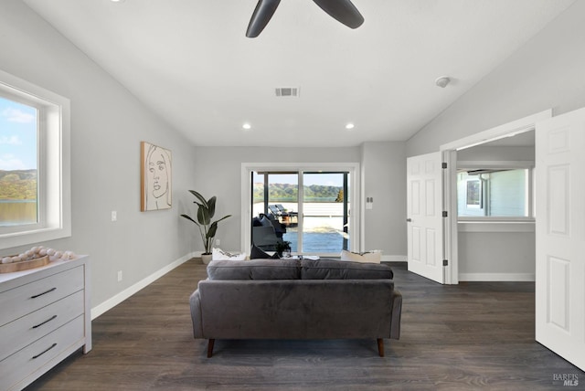 living room with vaulted ceiling and dark hardwood / wood-style floors