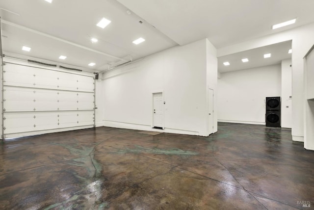 garage with stacked washer and dryer