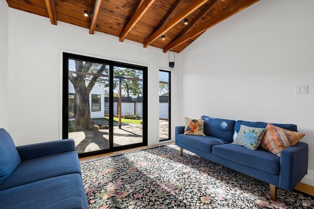 living room featuring lofted ceiling with beams, a water view, and wooden ceiling