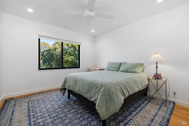 bedroom with hardwood / wood-style flooring and ceiling fan