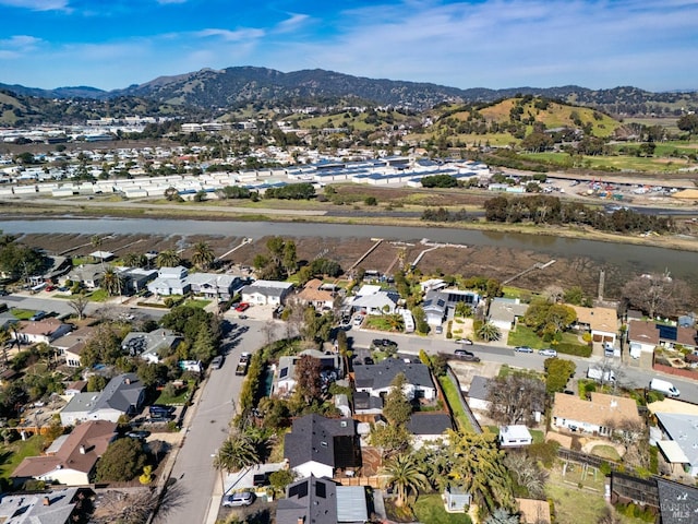 birds eye view of property with a mountain view