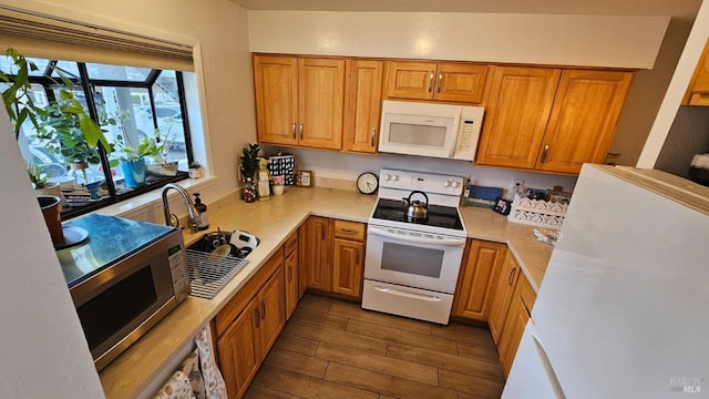 kitchen featuring sink and white appliances