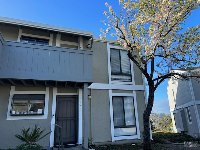 view of front of property with a balcony