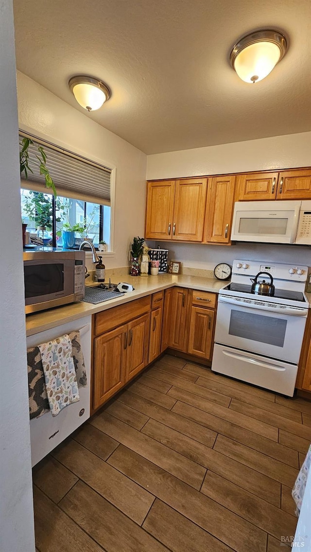 kitchen with sink and white appliances