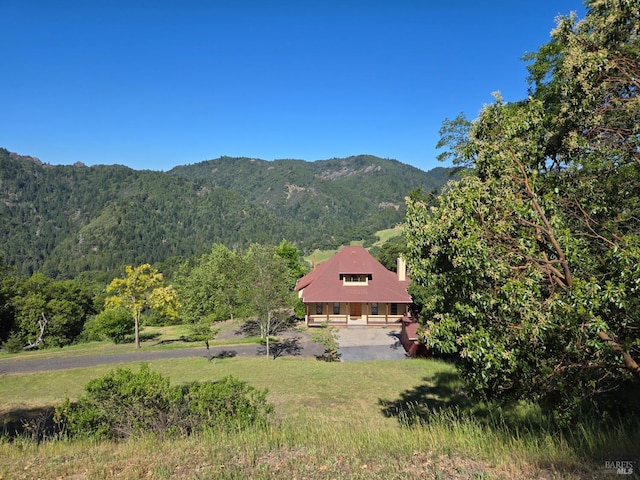 14950 Ridgeview Rd, Willits, CA 95490 - view of front of home with covered porch, a mountain view, asphalt driveway, and a front yard