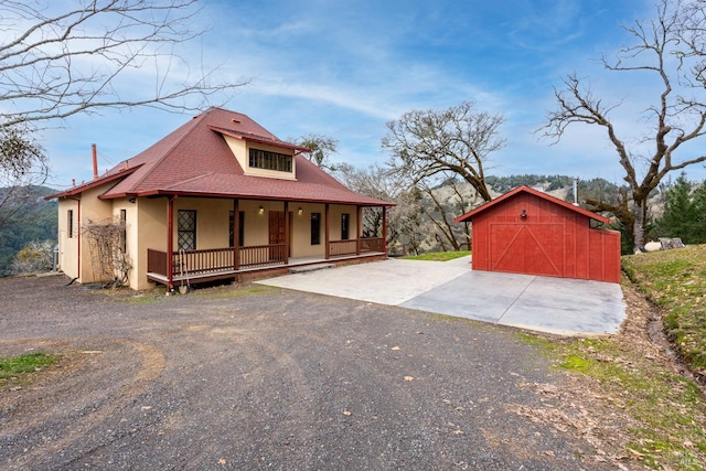 14950 Ridgeview Rd, Willits, CA 95490 - view of exterior entry with covered porch, stucco siding, and a shingled roof