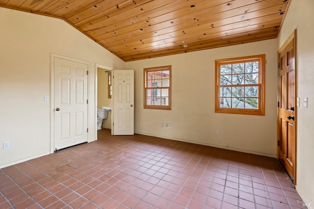 unfurnished bedroom featuring multiple windows, lofted ceiling, tile patterned floors, and wooden ceiling