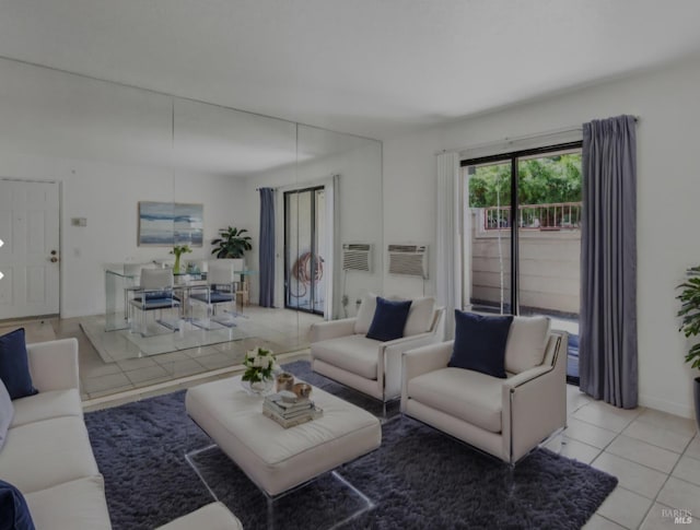 living area featuring a wall mounted air conditioner and light tile patterned floors