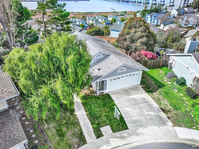 birds eye view of property featuring a water view and a residential view