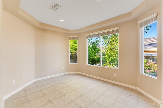 empty room with recessed lighting, baseboards, visible vents, and plenty of natural light