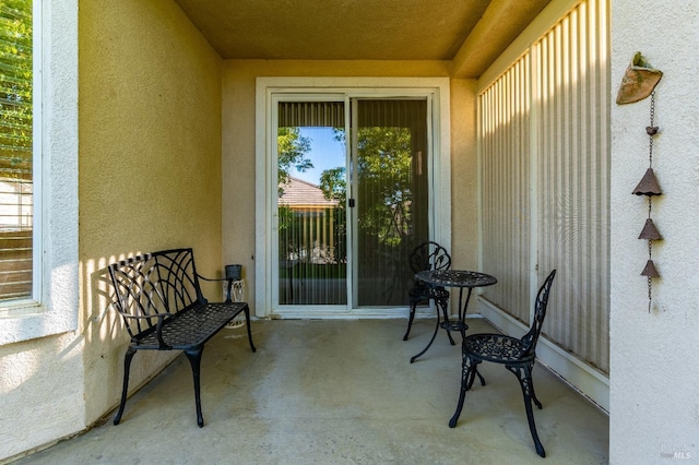 view of exterior entry featuring stucco siding