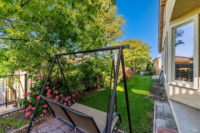 view of jungle gym with a lawn and a fenced backyard