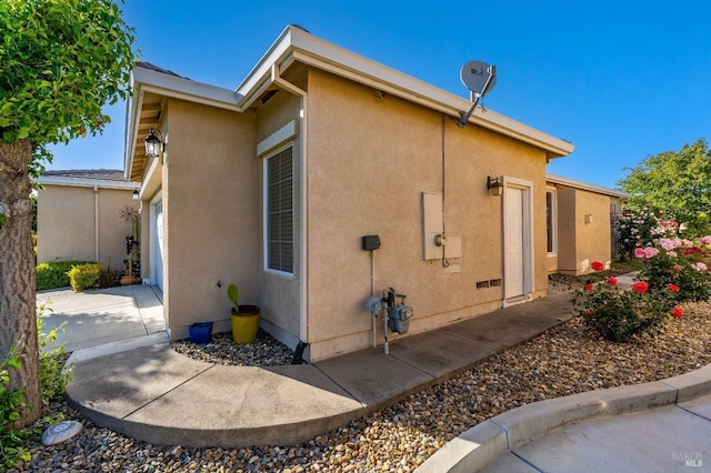 view of property exterior with stucco siding