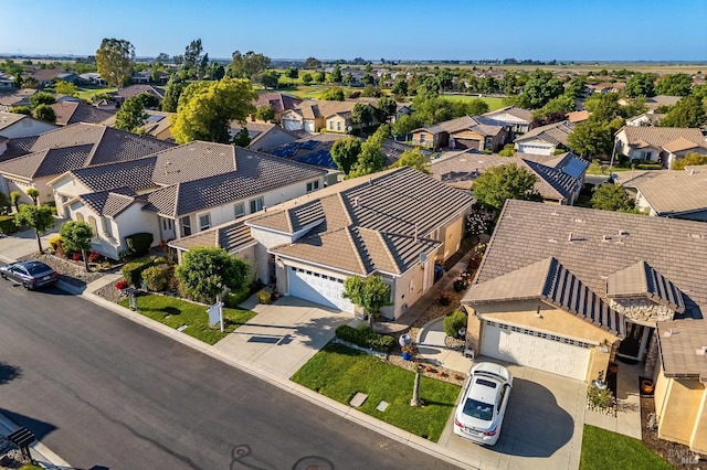 birds eye view of property with a residential view