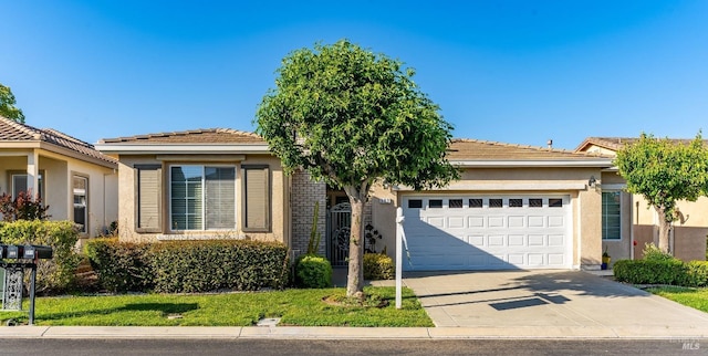 single story home with a tiled roof, an attached garage, concrete driveway, and stucco siding