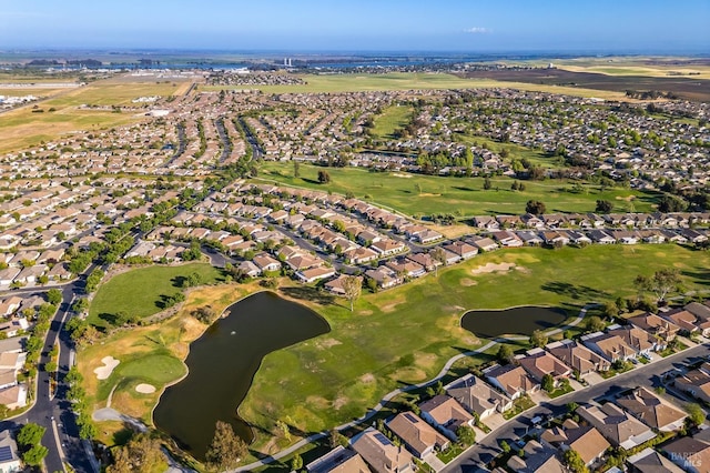 birds eye view of property with a water view, golf course view, and a residential view