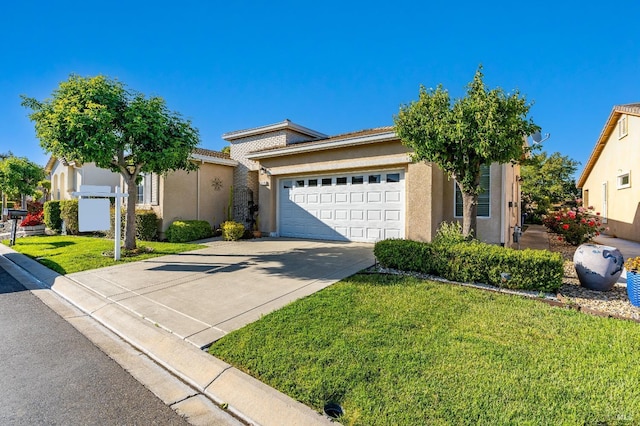 ranch-style home featuring an attached garage, a front lawn, driveway, and stucco siding