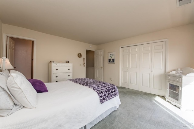 bedroom featuring carpet, a closet, and visible vents