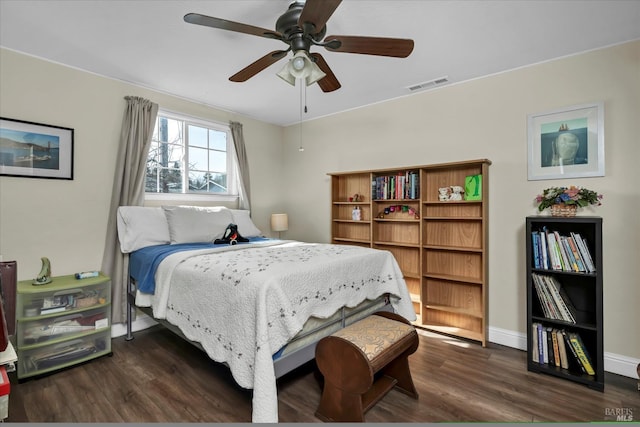 bedroom featuring ceiling fan and dark wood-type flooring