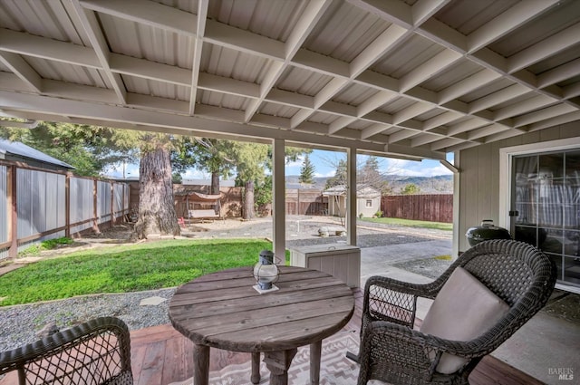 view of patio featuring a shed