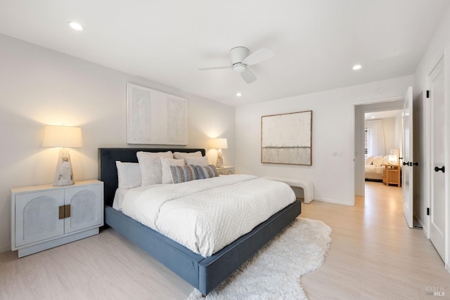 bedroom featuring ceiling fan and light hardwood / wood-style floors