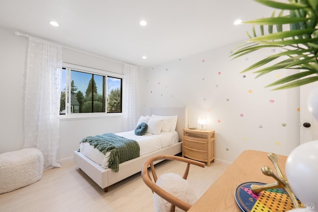 bedroom with light hardwood / wood-style flooring