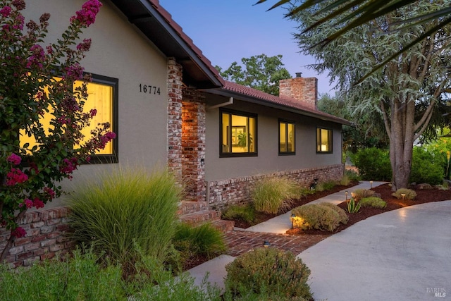 view of property exterior at dusk