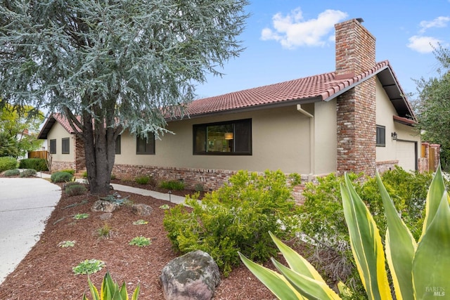 view of side of property with a garage