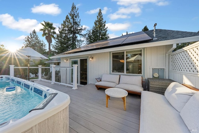 wooden deck with pool water feature, an outdoor living space, and a fenced in pool