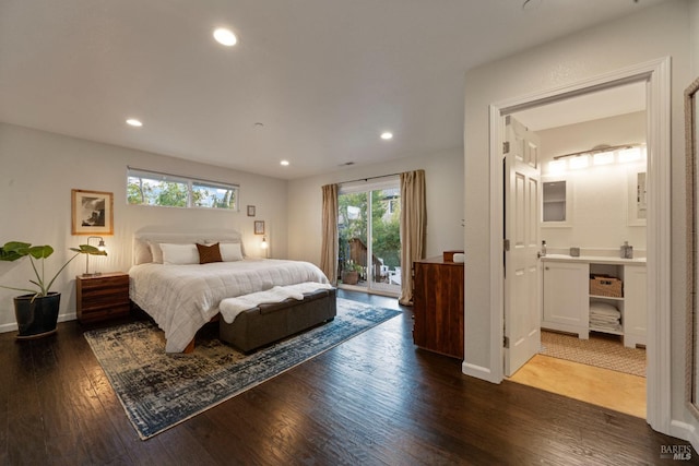 bedroom with access to outside, dark hardwood / wood-style flooring, and ensuite bath