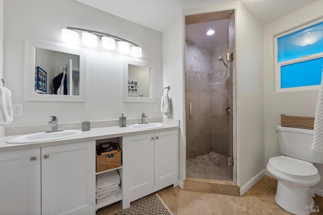 bathroom featuring vanity, toilet, an enclosed shower, and tile patterned flooring