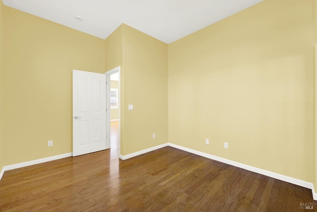 unfurnished room featuring hardwood / wood-style flooring