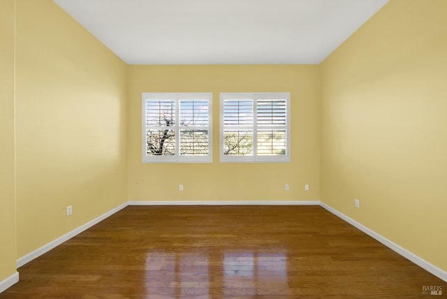 empty room featuring hardwood / wood-style flooring