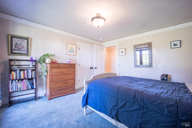 carpeted bedroom with ornamental molding