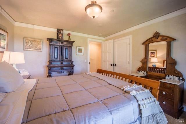 bedroom featuring ornamental molding and carpet