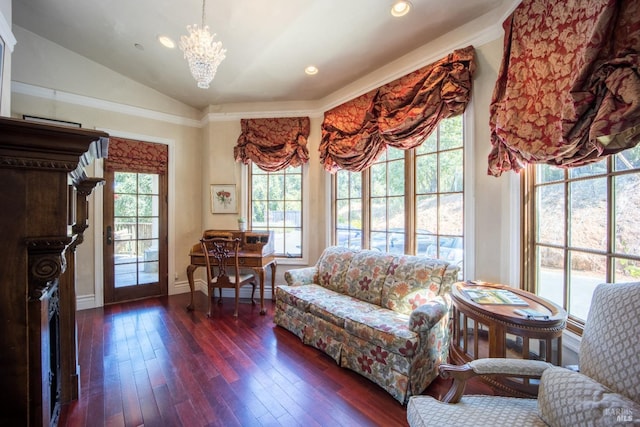 living room with lofted ceiling, a fireplace, a wealth of natural light, and dark hardwood / wood-style flooring