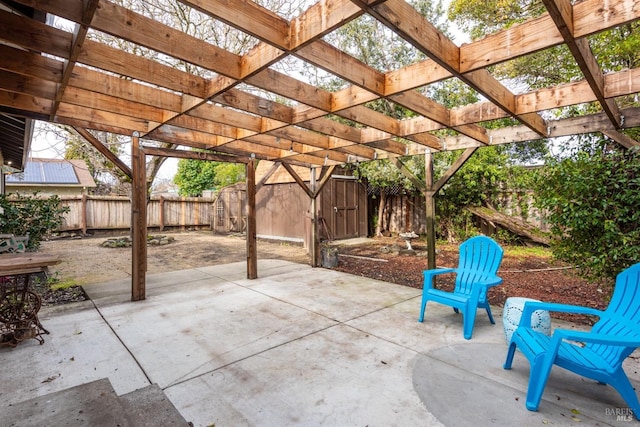 view of patio / terrace with a pergola and a shed