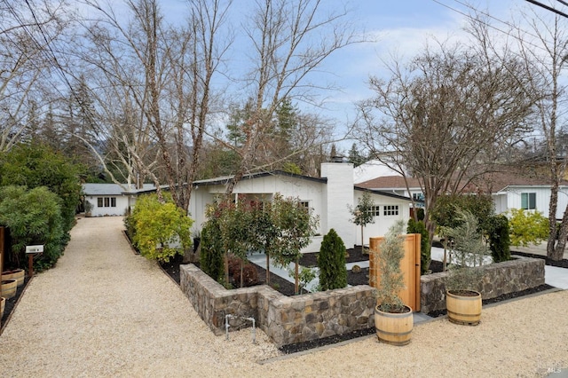 exterior space featuring a chimney