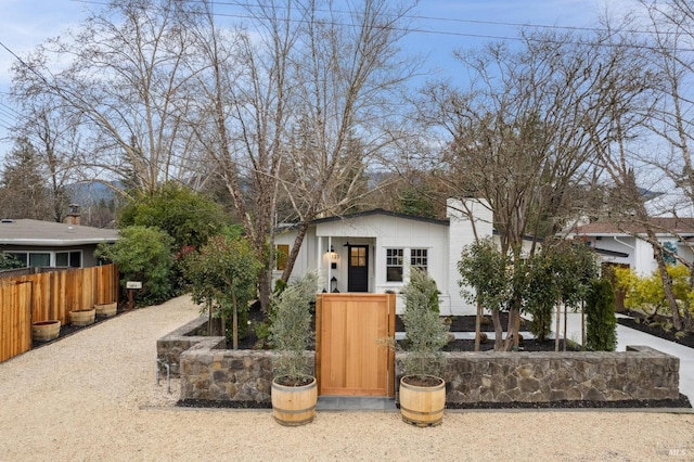 view of front facade featuring fence