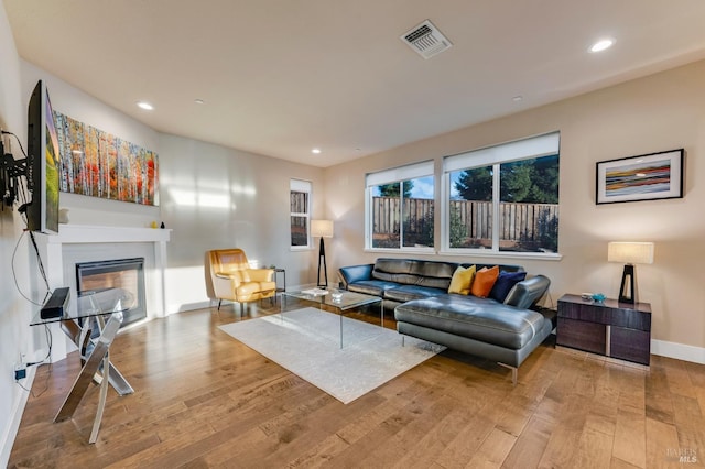 2228 Chateau Ct, Santa Rosa, CA 95404 - living area with light wood-type flooring, recessed lighting, visible vents, and a glass covered fireplace