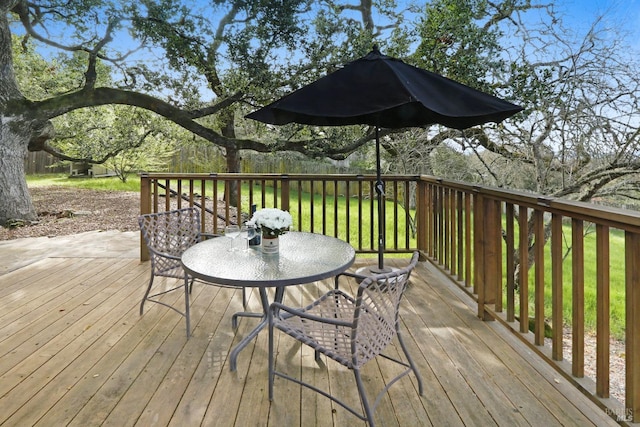 deck featuring outdoor dining area