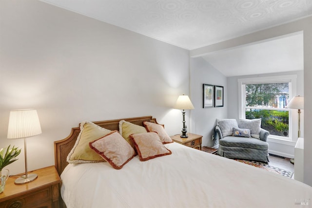 bedroom with lofted ceiling and visible vents
