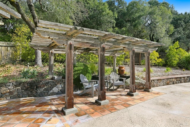 view of patio / terrace featuring fence and a pergola