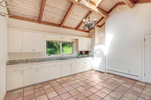 kitchen featuring wood ceiling, a baseboard radiator, light countertops, and freestanding refrigerator