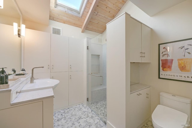 bathroom with wood ceiling, a shower with door, lofted ceiling with skylight, vanity, and toilet
