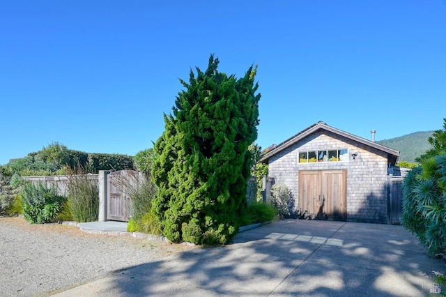 exterior space with a mountain view and an outbuilding