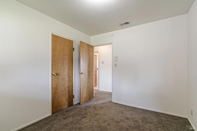 interior space featuring a textured ceiling