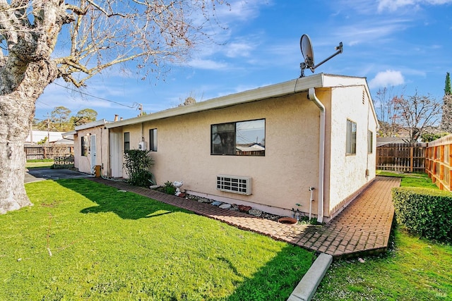 rear view of house with a yard