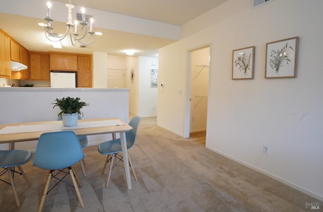 view of carpeted dining area